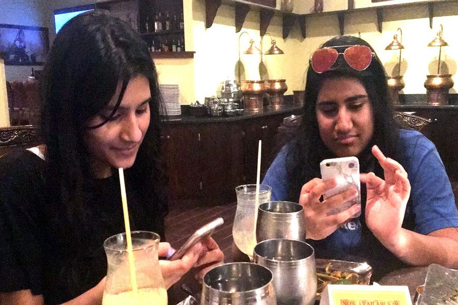 Instead of focusing on each other, friends are focusing on their phones