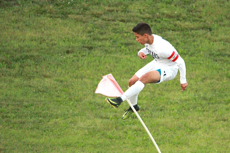 Gonzalez kicks the corner flag in celebration.