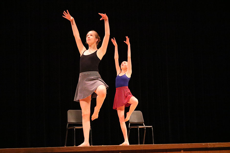 Freshman Julia Lawton (left) dances with freshman Claudia Obenschain (right) in Obenschain’s routine, created to show the pattern of a follower. 