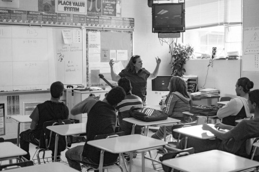 Walton snaps Kelley explain her lesson with enthusiasm.  