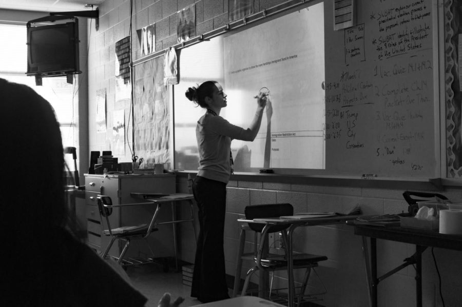 Dean draws out her lesson on the board during her US History class.