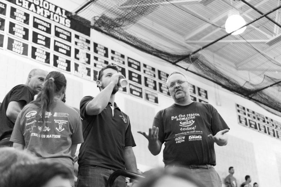 Walton snapshots Cosner and Tueting engaging in conversation following a Pep Rally. 