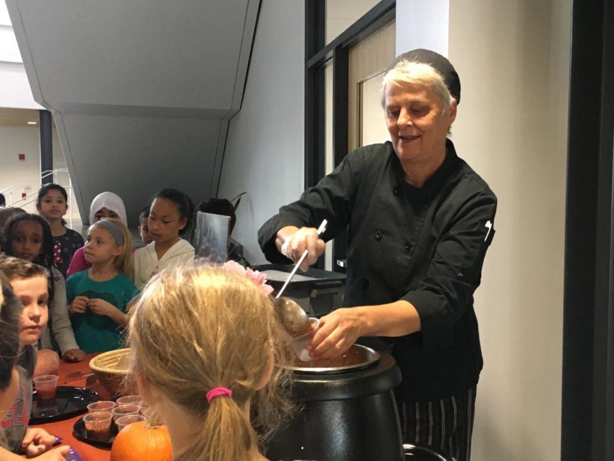 Bowl of Good catering and procurement manager Jan Henley prepares cups of soups for the Bluestone elementary school studnets on their way to lunch 