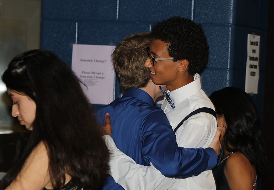 Seniors Garrett Cash and Isaiah King hug.