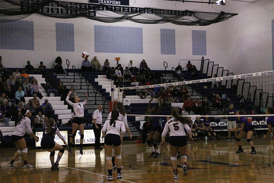 Sophomore Ella Kearney prepares to kill the ball over the net.