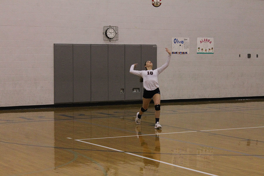 Sophomore Abby McCollum gets ready to serve the ball.
