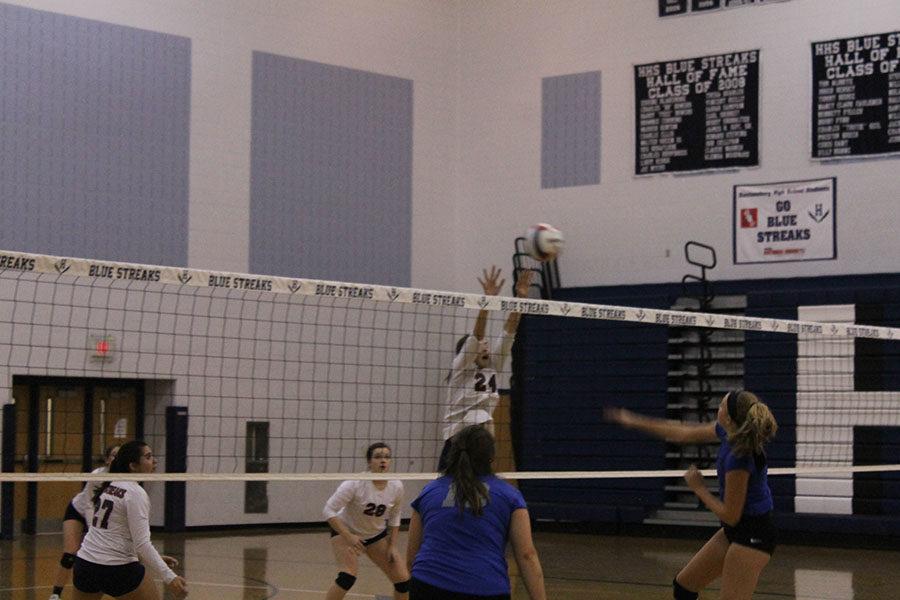 Freshman Elsie Hammond jumps to save the ball from going on their side. 