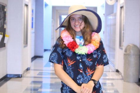 Junior Jayln Sneary poses for a photo in Hawaiian gear.