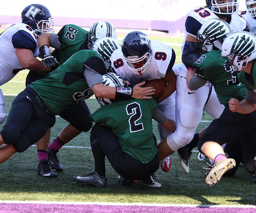 Junior Marcus Robinson-Jenkins runs up the middle on the goal line to score a touchdown against the Gobblers of Broadway. The Streaks went on to beat the Gobblers 35-6. 