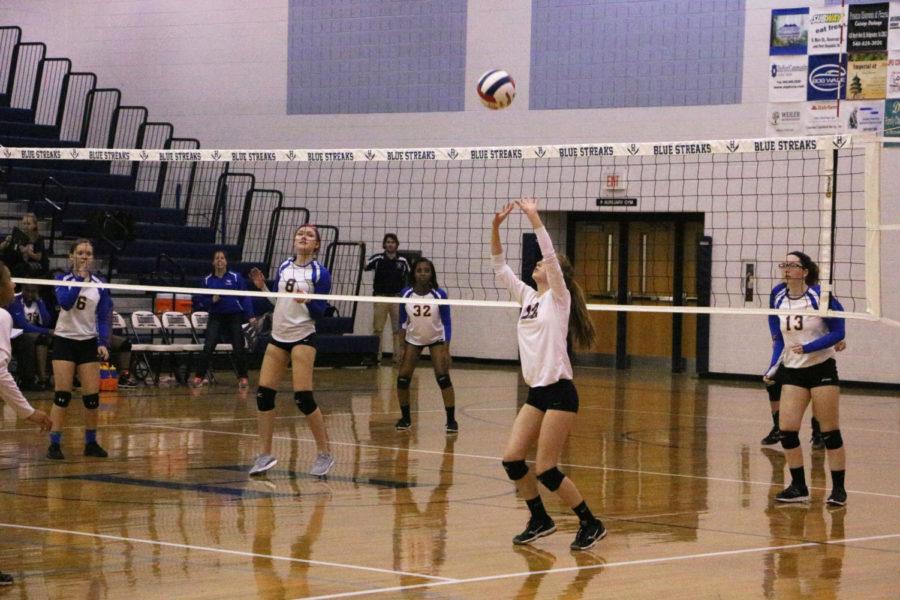 Sophomore+Whitney+Purcell+sets+the+ball+to+teammate.+