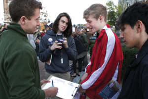 Seniors Jack OBrien and Martin Beck sign up to help local politician Brent Finnegan with his campaign. Finnegan is in favor of a new Harrisonburg High School. “I wouldn’t say I’m against Students Over Structures. I would say I’m for funding education from the state level, making it a priority at the state level, Finnegan said.