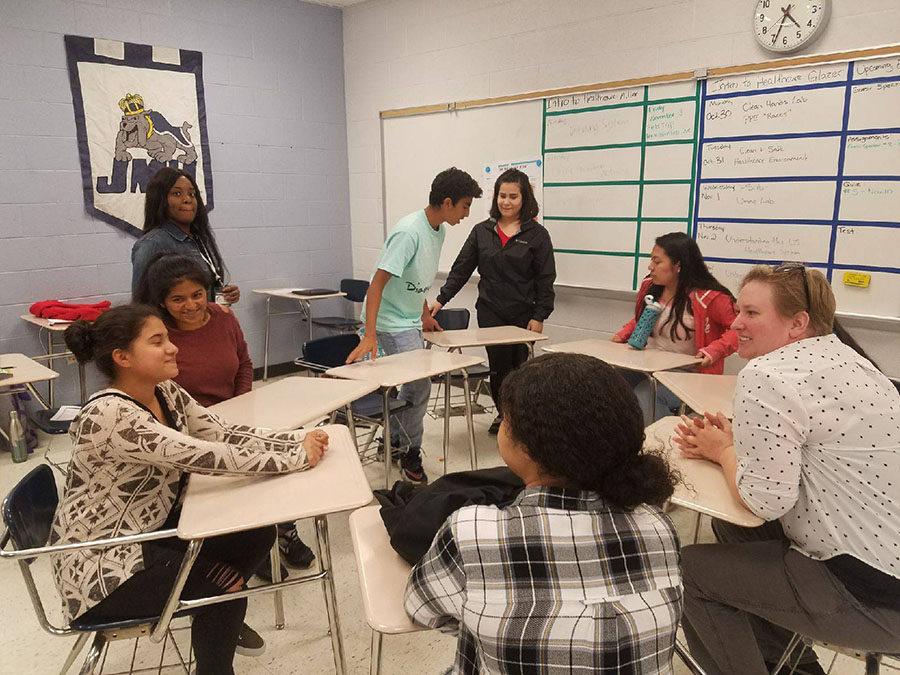 Several students in ninth grade academy meet to set plans and goals for what they want to do to help Anicira, a non-profit animal shelter.