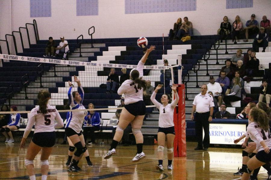 Junior Rebecca Staton returns the ball with a spike back at William Fleming.