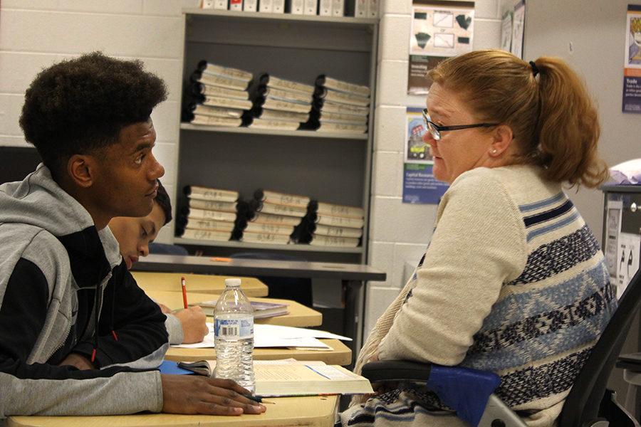 Junior D’Andre Moats works with teacher Melissa Thurman	 during night school. “[Night school] is more interaction,” Moats said. “If you would like a teacher in front of you, helping you a lot more, I would recommend night school.”