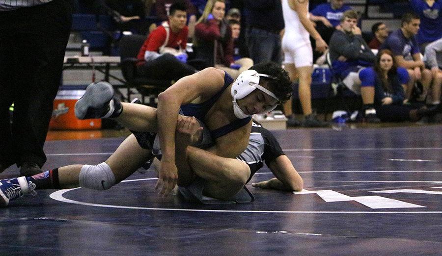 Guillermo Torres pins down Turner Ashbys Payton Jackson as the clock winds down. Torres went on to with the match 21-6.