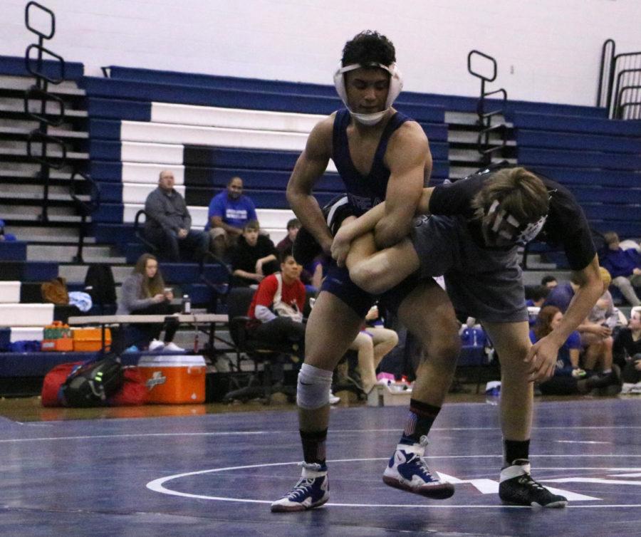 Guillermo Torres twists Payton Jackson and forces him down on the mat. 