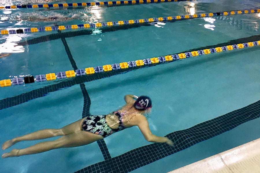 Senior Jane Wyatt competes in the 100 meter breaststroke.