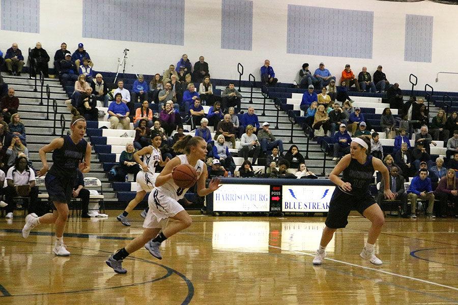 Senior Marissa Madden takes off down the court past Spotswoods defenders. 