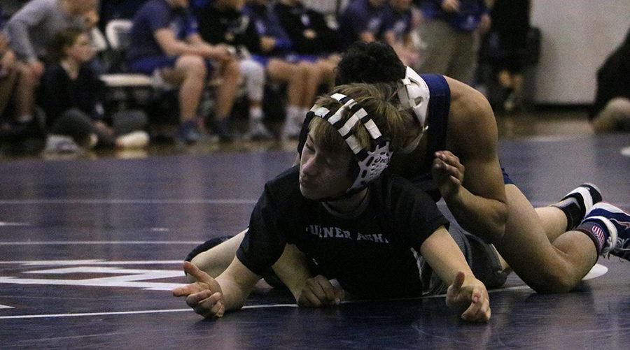 Guillermo Torres pins holds down Payton Jackson to remain in the lead.