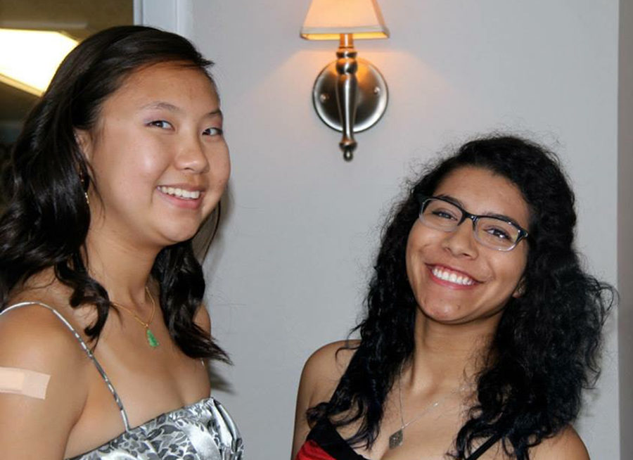 Isabella Marian (right) gets ready for her high school senior year Homecoming.