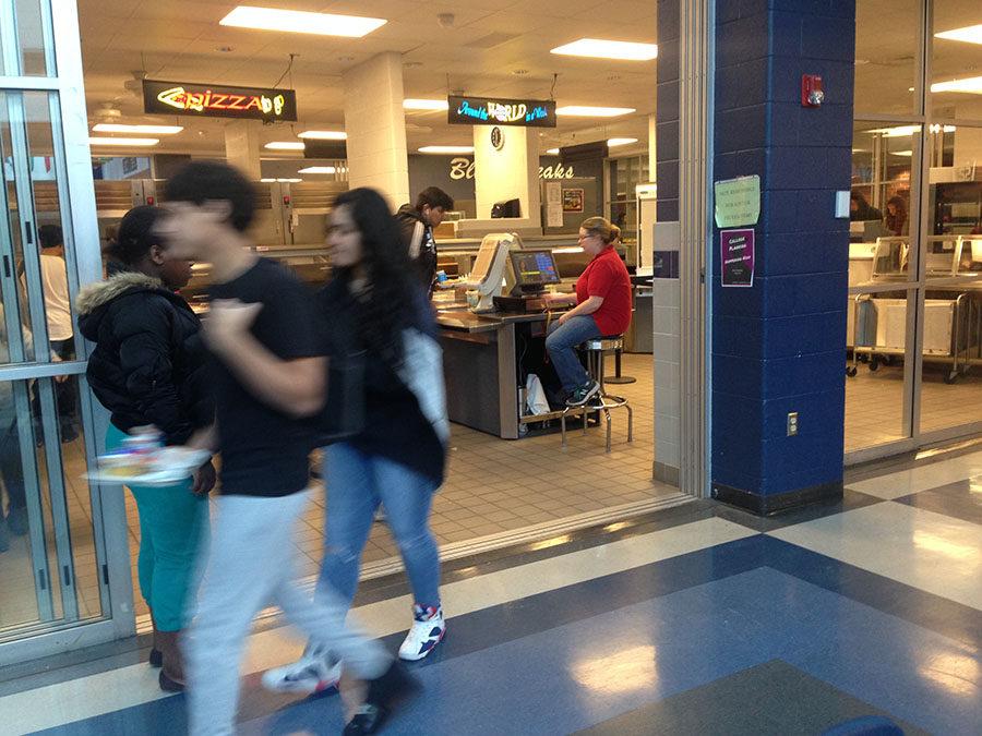 Students walk in and out of one of the lunch lines.