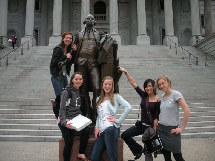 Domonoske (front left) poses in front of a statue on a Newsstreak trip.