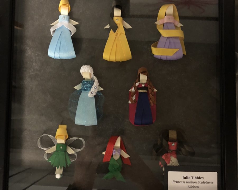 Math teacher Julie Tibbless art piece, titled Princess Ribbon Sculptures, features Disney princesses made out of pieces of colored ribbon. 