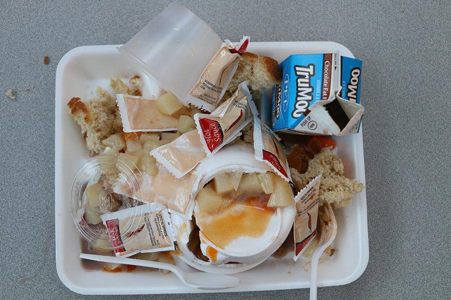 A students lunch tray sits on a table after third lunch.