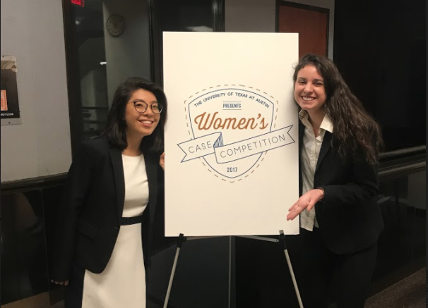 Faith Runnells (right) poses in front of the sign presenting the National Womens Case Competition in Austin, Texas with the University of Texass McCombs School of Business. 