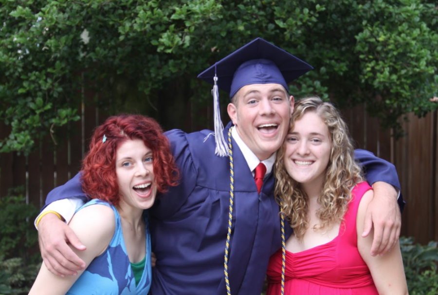 Colin Newcity poses with his two sisters, Aidan Newcity (left) and Allison Newcity, after his high school graduation in 2009. 