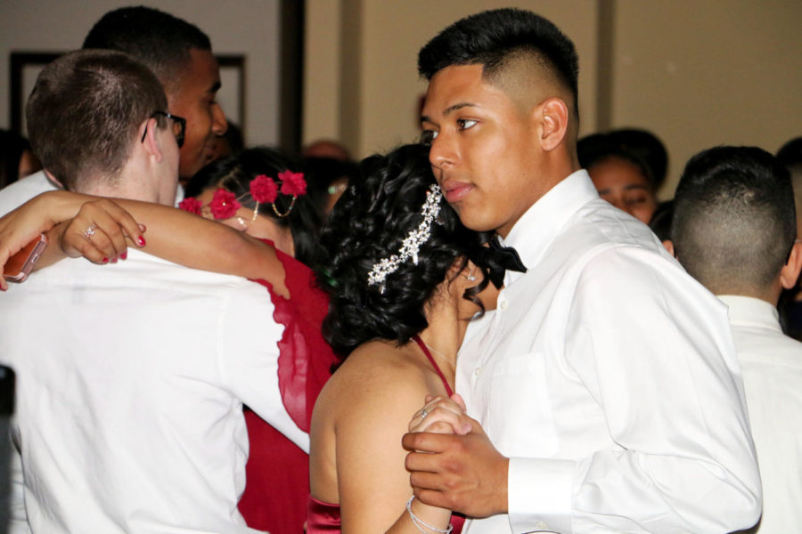 Aguilar and his date dance during a slow song.