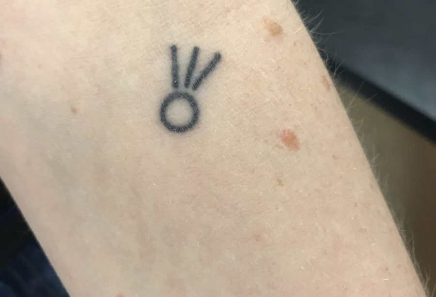 Gelberg-Hagmaier shows off her comet tattoo.