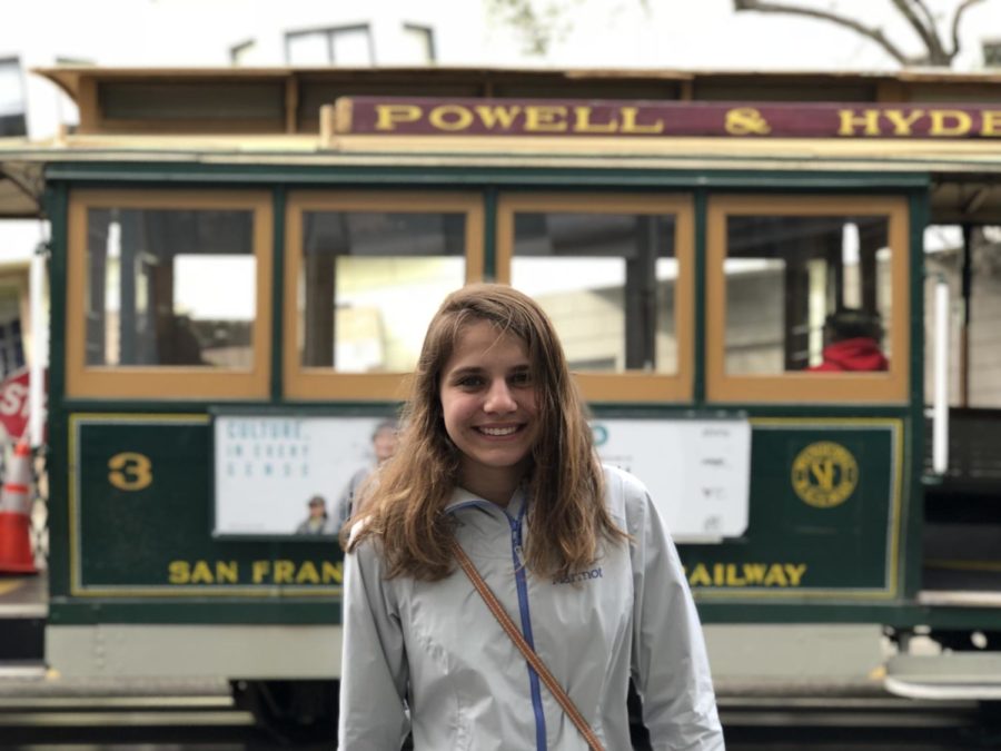 The+writer+stands+in+front+of+a+trolley+car+while+on+a+trip+to+San+Francisco