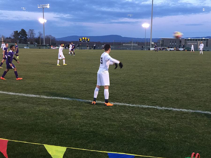 The blue streaks throw the ball back into the field.
