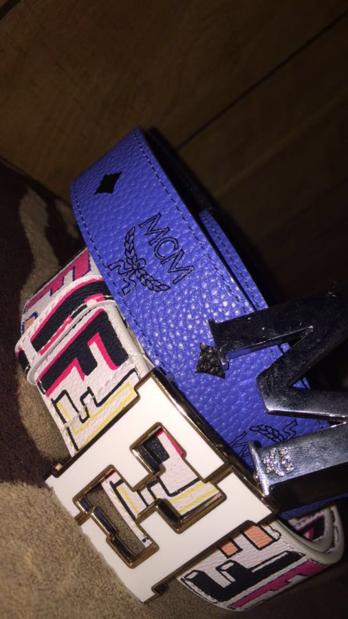 Two designer belts that the writer owns.