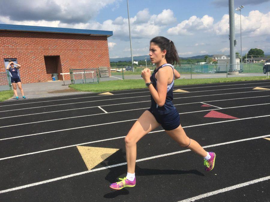 Sophomore Ana Rodriguez competes in the 4x800m relay at the regional track meet. Rodriguez is also an exchange student from Spain. 