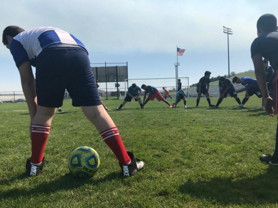 Team warm ups consist of stretching and passing between teammates. 

