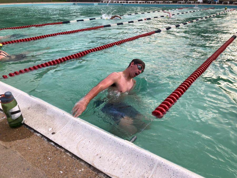 Junior Kyle Brown pushes off the wall during his freestyle set at the Westover Waves swim practice. 