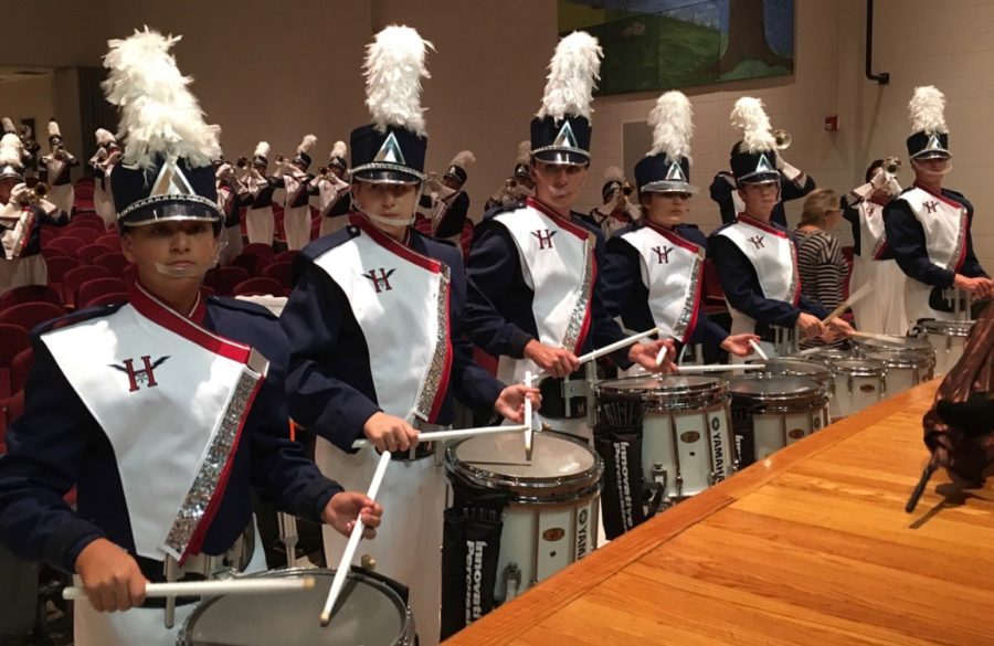 The drumline warms up with the band before performing the stand-still show at Stuarts Draft High School. 