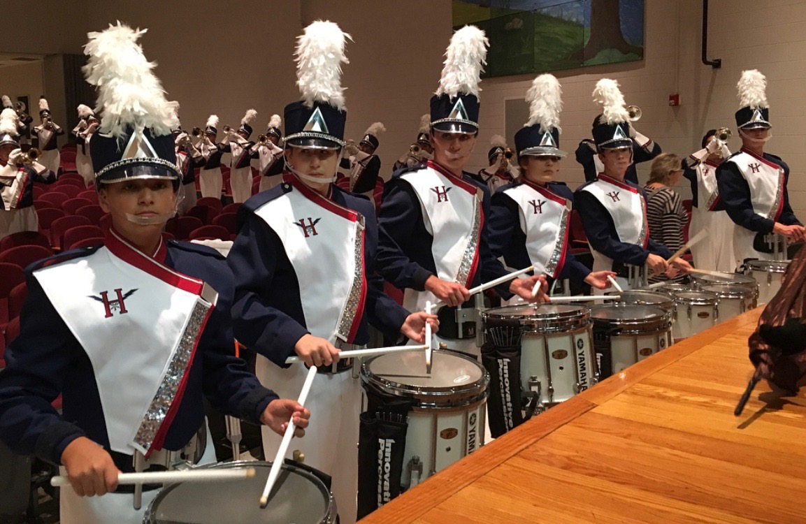 The drumline warms up with the band before performing the stand-still show at Stuarts Draft High School.