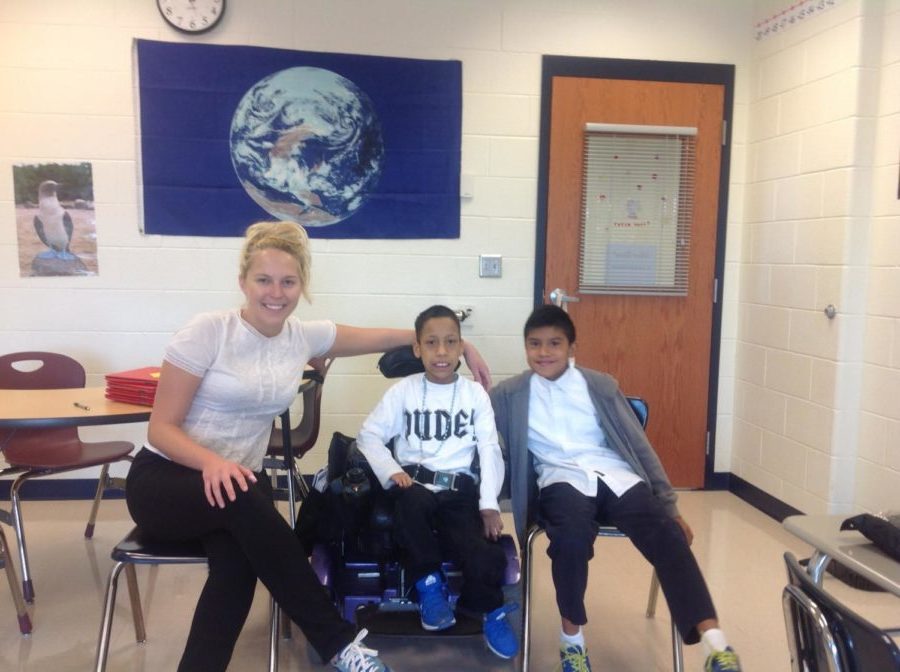Special education teacher Kelsey Bass works with previous Skyline Middle Schoolers Alan Garcia Ruiz  and John Lopez. Ruiz and Lopez are current freshmen at the high school this year. 