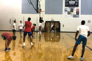 Boys basketball players participate in preseason practice. 