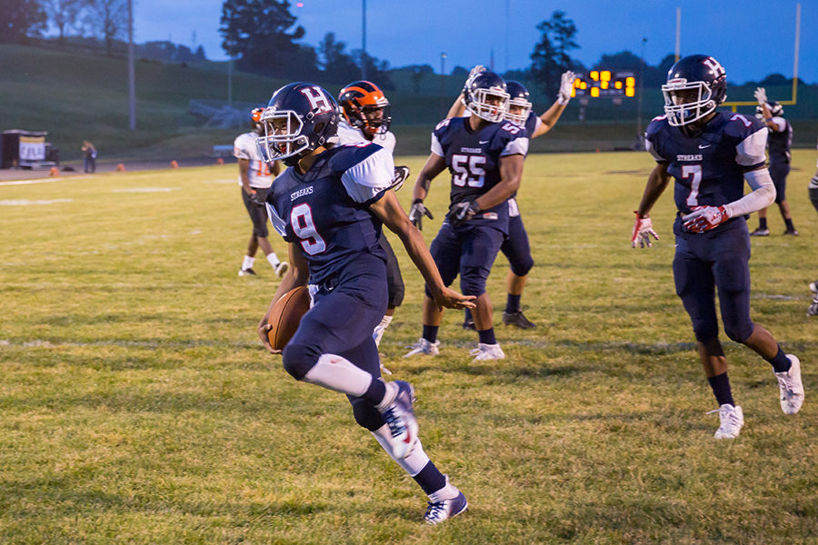 Junior quarterback Kwentin Smiley celebrates after a touchdown. Smiley had 362 total yards and five touchdowns.