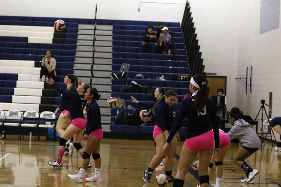The HHS Varsity Volleyball team warms up before their match against Rockbridge.