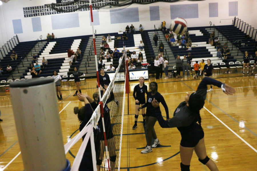 Nazario goes up to hit the ball prior to the game. Nazario finished the match with eight kills and a block.