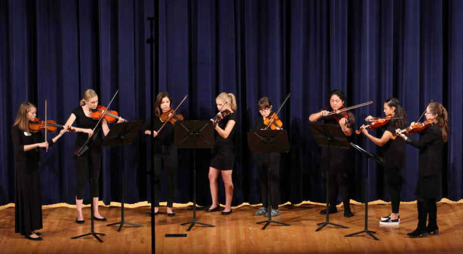 The HHS Strings program performs a piece.