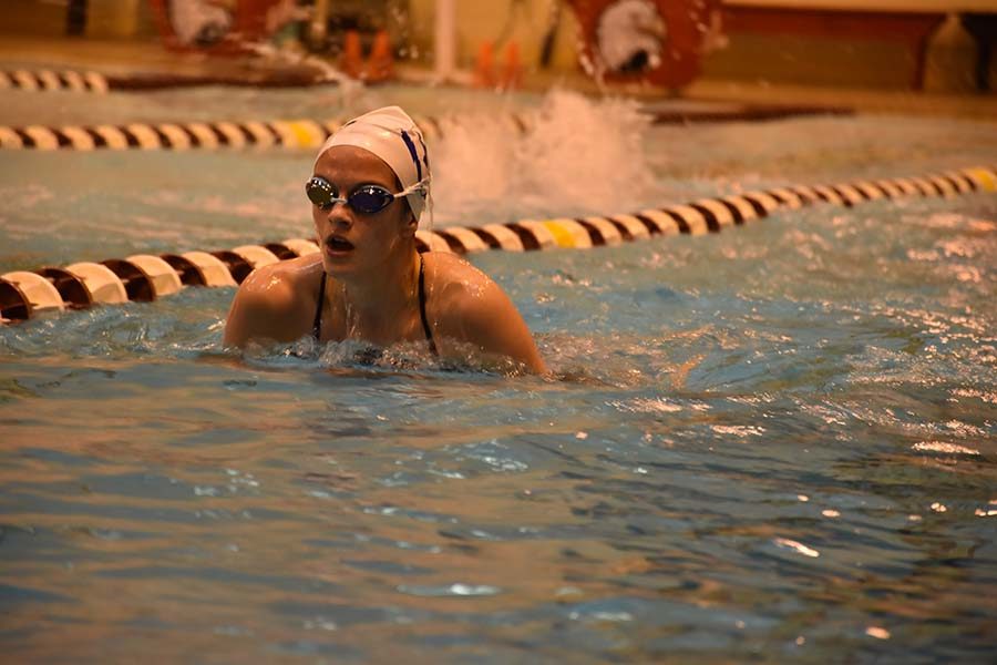 Isabel Campillo swims breaststroke during warm up.