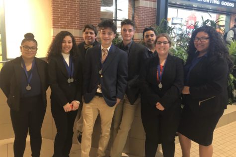 DECA members take a group picture after competing in Districts. 