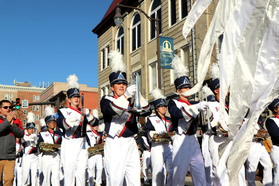 Harrisonburgs marching band takes a break between pieces while walking down South Main St. for the annual Veterans Day parade. 