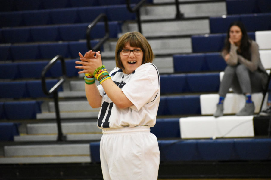 Ella Shminkey Ward claps during the third quarter of the first game.